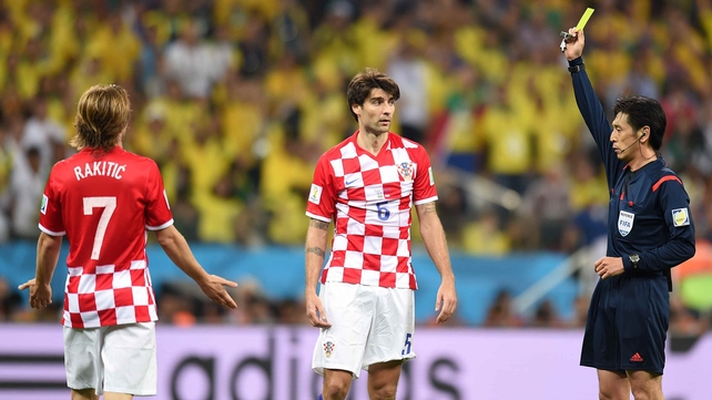 Nishimura grants Fred's request, handing a yellow card to Croatian defender Dejan Lovren