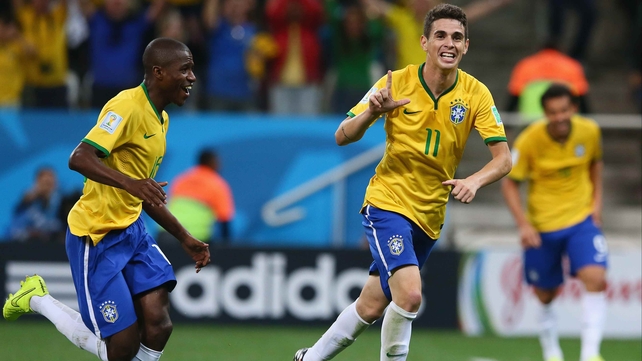 Oscar celebrates, as Brazil exits the first day of World Cup action with a solid three points to their name