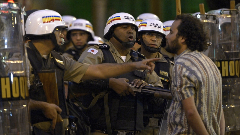 A protester confronts police in Belo Horizonte