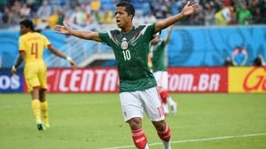 Mexican midfielder Giovani dos Santos reacts after an offside call disallowed his 13' goal