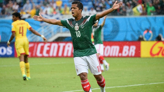 Mexican midfielder Giovani dos Santos reacts after an offside call disallowed his 13' goal