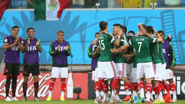 Peralta and his team-mates celebrate the goal
