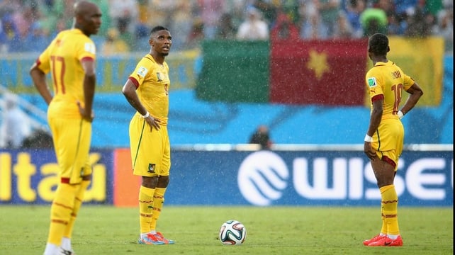 Eto'o looks dejected after Mexico pulls ahead during the rainy match play