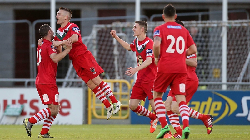 Cork City's Mark O'Sullivan celebrates with his teammates after scoring the first goal of the game
