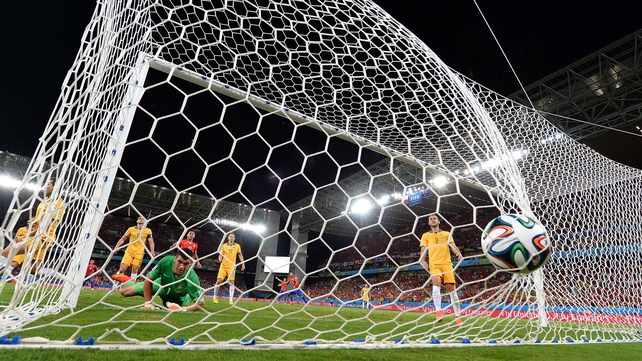 Australia goalkeeper Maty Ryan looks on, as the ball hits the back of the net