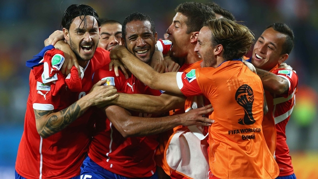Yet, it was Chile's night in the end, as midfielder Jean Beausejour (second from left) knocked in a final goal in extra time to solidify the winning score at 3-1