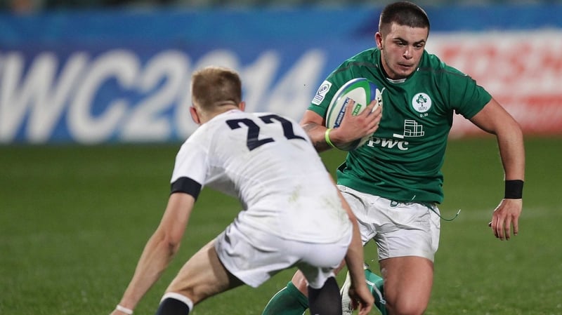 Ireland’s Ryan Foley is tackled by Sam Olver of England