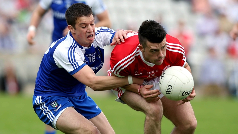 Darren McCurry of Tyrone with Gerard McCaffrey of Monaghan