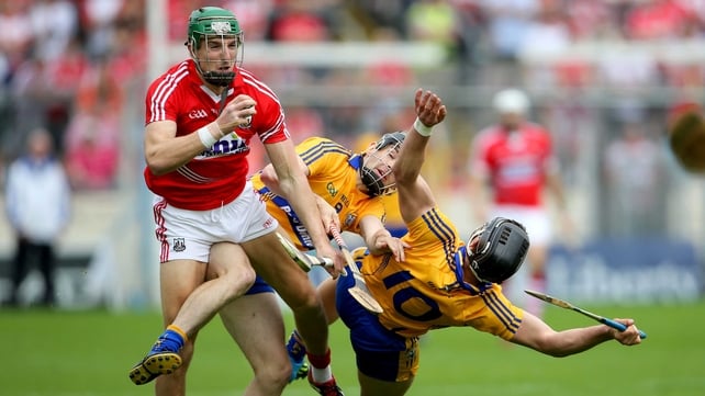 Clare's Pat Donnellan and John Conlon collide with Aidan Walsh of Cork