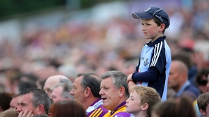 A young Dublin fan watches his county take on Wexford in the Leinster Hurling Championship