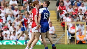 Dermot Malone of Monaghan confronts Peter Harte of Tyrone after scoring a goal during the Ulster Football Championship quarter-final