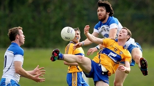 Clare’s Barry Hartnett and Tommy Prendergast of Waterford battle for possession during the Munster SFC clash