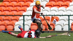 Armagh's Connor Devlin attempts to steal possession as Derry's Brendan Rogers scrambles for possession during the Ulster Hurling Championship quarter-final