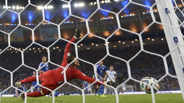 Asmir Begovic in the Bosnia and Herzegovina goal is unable to stop Lionel Messi's effort