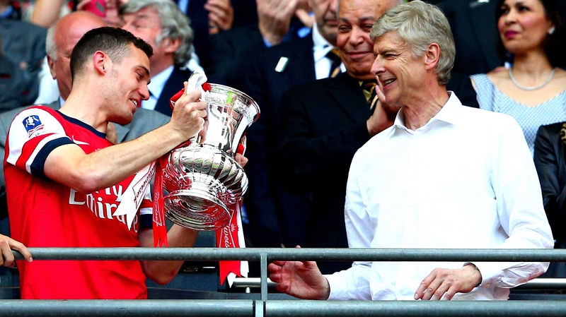 Thomas Vermaelen pictured with Arsenal manager Arsene Wenger after the side's FA Cup final win in May