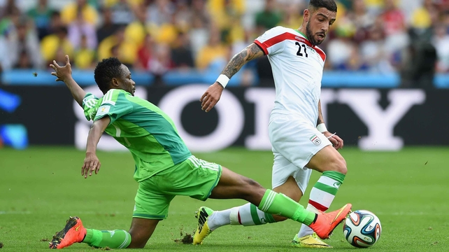 Nigeria forward Ahmed Musa extends to challenge Iran forward Ashkan Dejagah