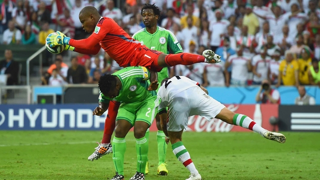 Enyeama dives ahead to secure the ball