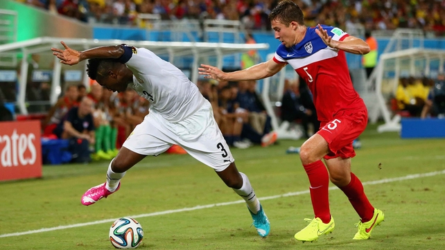 Ghana forward Asamoah Gyan and USA defender Matt Besler vied for the ball, in what proved to be a fast-paced, highly physical match