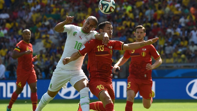 Algeria forward Sofiane Feghouli vies with Belgium midfielder Eden Hazard during the first half of the match, which saw Algeria play a disciplined, steady game, while Belgium seemed disjointed
