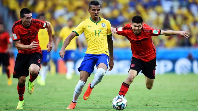 Mexico midfielder Hector Herrera, Brazil midfielder Luiz Gustavo, and Mexico forward Oribe Peralta, during the match which saw both teams split possession evenly down the line