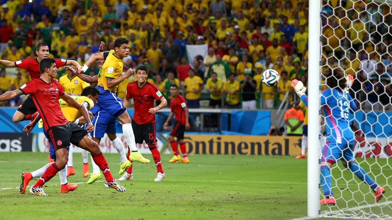 Guillermo Ochoa makes a save after a header by Thiago Silva