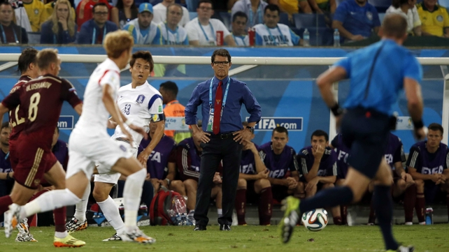 Russia coach - and former England coach - Fabio Capello watches the action with a look of dubious gloom