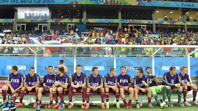 Russian players sit on the bench. Russia is the only squad of the 32 that selected exclusively domestic players to make the trip to Brazil