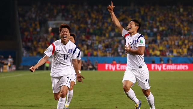 Korea forward Lee Keun-Ho (R) celebrates the goal, which drove the score to 1-0