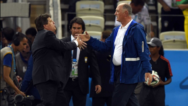 Brazil manager Luis Felipe Scolari and Mexico coach Miguel Herrera shake hands after the final whistle at Estadio Castelao
