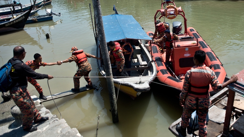 A search and rescue team returns from the rescue mission on the outskirts of Banting