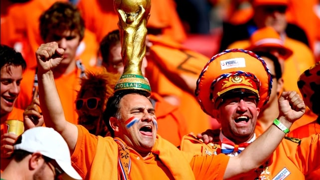 Here, a Netherlands fan shows off his quite classy, golden hat