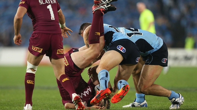 Ouch: Nate Myles of the Maroons is tackled by Anthony Watmough of the Blues during game two of the State of Origin series between the New South Wales Blues and the Queensland Maroons