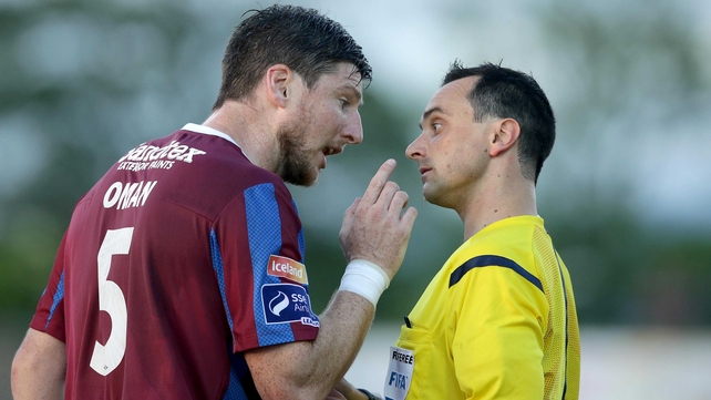 St Patrick's Athletic's Ken Oman is distinctly unimpressed with referee Neil Doyle after being shown a red card during Pat's game with Dundalk