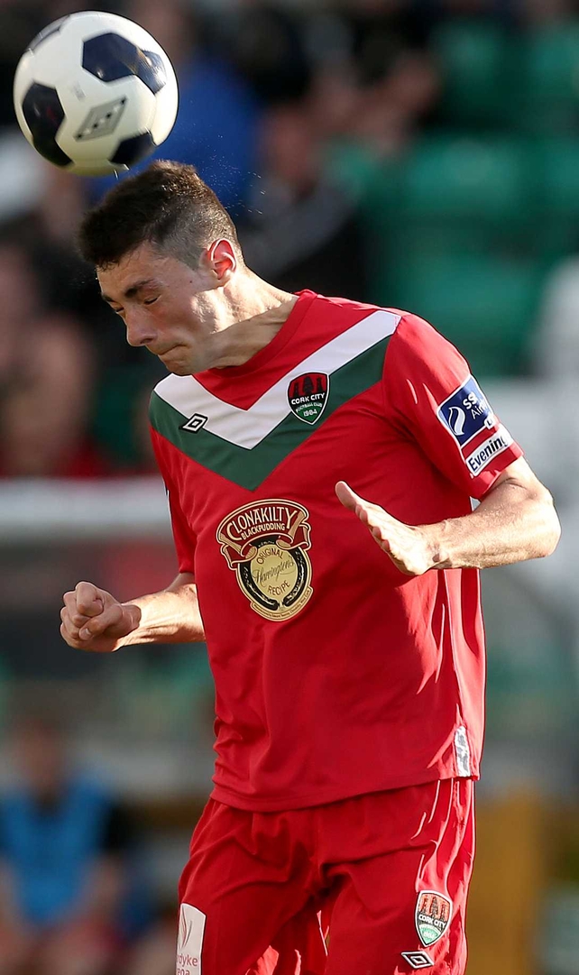 Brian Lenihan of Cork City leaps for the ball against Shamrock Rovers