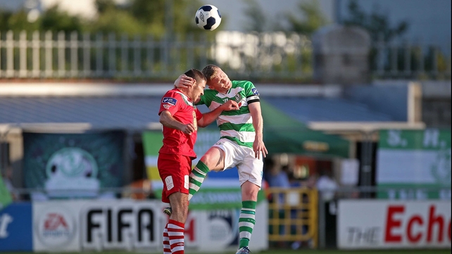 Shamrock Rovers' Conor Kenna and Mark O'Sullivan of Cork City in an aerial battle for the ball