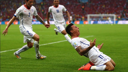 Chile's forward Eduardo Vargas celebrates with his team-mates after scoring