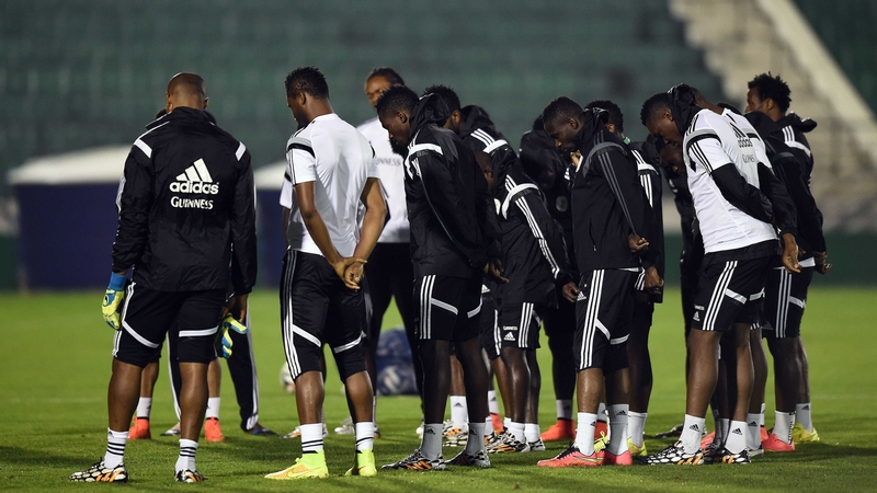 Nigerian players observe a moment of silence before training in honour of the victims of the bomb