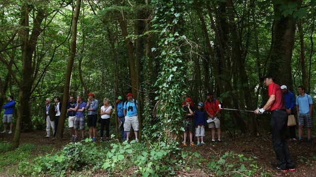 Ross Fisher watches his second shot on the 18th during Day One