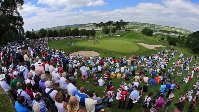Large galleries watching Graeme McDowell, Paul Casey and Shane Lowry on the par 3 7th on Day One