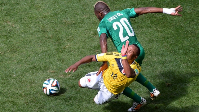 Both sides ramped up the tackles to try and assert themselves. Here, Serrey challenged Colombia midfielder James Rodriguez...