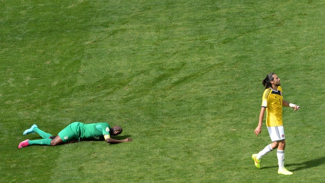 Ivory Coast midfielder Yaya Toure couldn't find a way to make much of an impact in the first half. Here, Colombia defender Mario Yepes simply walks away from the helpless Toure
