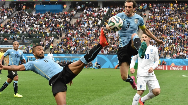 Rooney watched on as Uruguay midfielder Alvaro Pereira and defender Diego Godin athletically controlled the ball