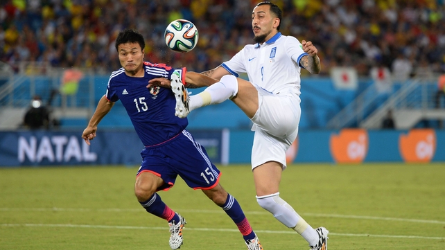 Both sides started the match off slowly. Here, Greece forward Konstantinos Mitroglou controlled the ball against Japan defender Yasuyuki Konno