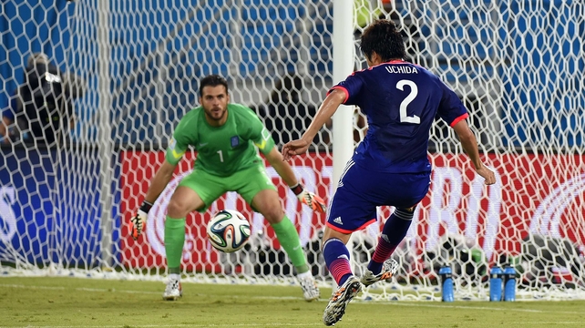 Japan defender Atsuto Uchida made a late go at Greece goalkeeper Orestis Karnezis...