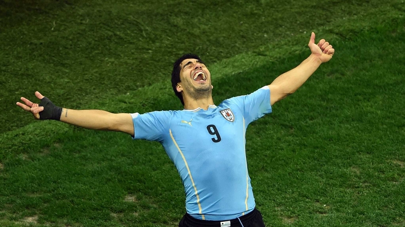 Luis Suarez scored twice to leave England's World Cup hopes hanging by a thread