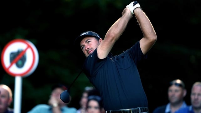 A renegade Press Association photographer snaps Graeme McDowell on the 12th tee during day two