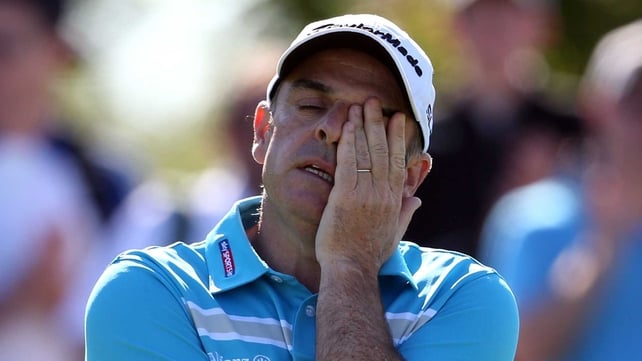Paul McGinley reacts on the 14th green during day two