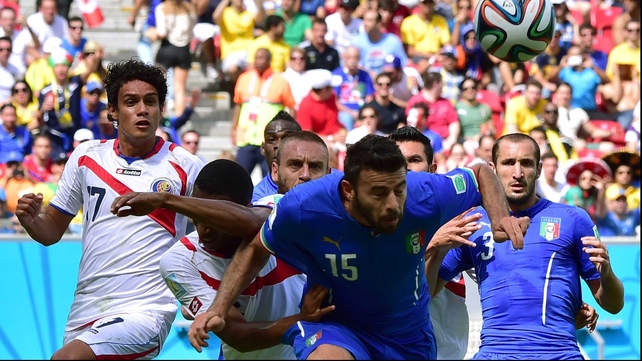 Italy defender Andrea Barzagli cleared the ball away with a strong header