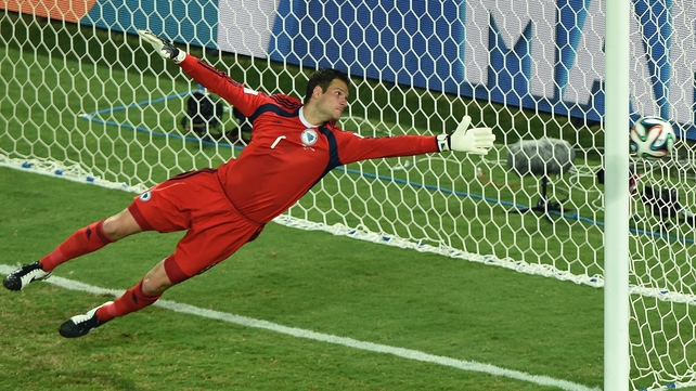 Asmir Begovic sees a Nigerian free-kick just go past his post