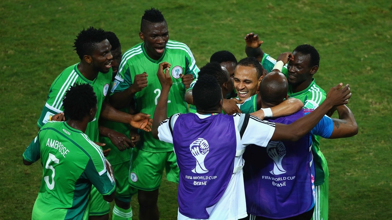 Nigeria's players congratulate match-winner Peter Odemwingie